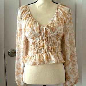 Express sheer feel top. V-neck with stretch at waist.  Gold shimmer.  Size XS